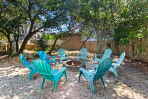 a group of blue chairs around a fire pit at 1689 - Maison de la Mer in Poplar Branch +39 photos