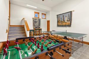 a room with a ping pong table and a ping pong ball at 1812 - The Original Sound and the Fury in Poplar Branch