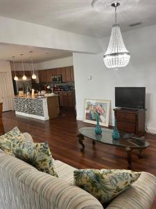 a living room with a couch and a coffee table at Cozy LeHigh Extended Stay in Fort Myers