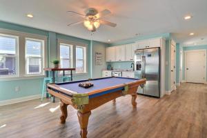 a pool table in a kitchen with a ceiling fan at 4057 - Fairways Seaspray in Kitty Hawk Beach