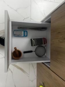 a drawer in a kitchen with some items in it at Tanki flip Property 2 in Noord
