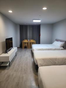 Postel nebo postele na pokoji v ubytování Hotel Modak Namdaemun