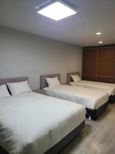 Postel nebo postele na pokoji v ubytování Hotel Modak Namdaemun