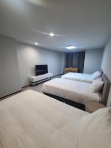 Postel nebo postele na pokoji v ubytování Hotel Modak Namdaemun