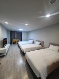 Postel nebo postele na pokoji v ubytování Hotel Modak Namdaemun