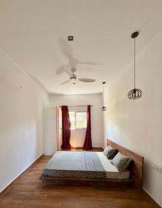 Ένα ή περισσότερα κρεβάτια σε δωμάτιο στο Villa Soafeno
