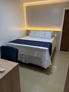Postel nebo postele na pokoji v ubytování Hotel Bastos + 1 fotografie