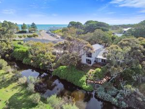 an aerial view of a house next to a river at Bungala Cottage 28 Jetty Road in Normanville