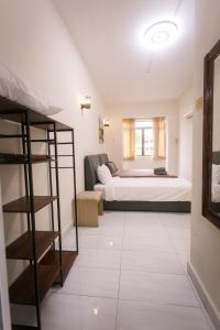 a bedroom with a bed and a bunk room at Bayu Beach Resort Apartment Seaview Private Beach in Port Dickson