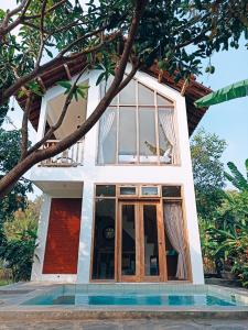 a villa with a view of the house at Sri Gaïa Yogyakarta in Imogiri