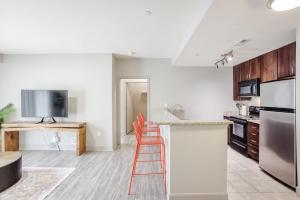 a kitchen with a counter with a ladder in it at CozySuites at the Banks gym pool 08 in Cincinnati