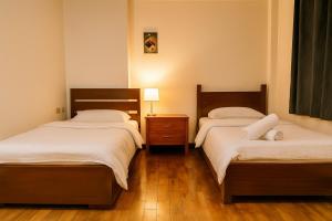 Postel nebo postele na pokoji v ubytování ZB Suites