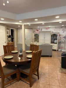 a dining room with a wooden table and chairs at Pepper Bungalow in Mesa