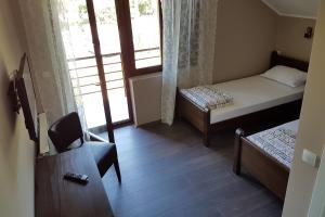 Postelja oz. postelje v sobi nastanitve Apartmani Simić Valjevo