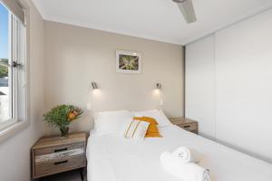Ένα ή περισσότερα κρεβάτια σε δωμάτιο στο Broken Head Holiday Park