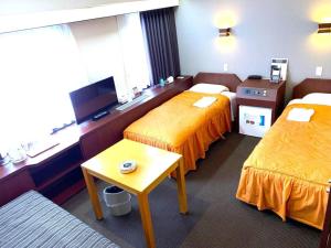 Ένα ή περισσότερα κρεβάτια σε δωμάτιο στο Hotel Suncity Ikebukuro +200 φωτογραφίες