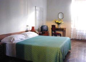 Кровать или кровати в номере Albergo Anna
