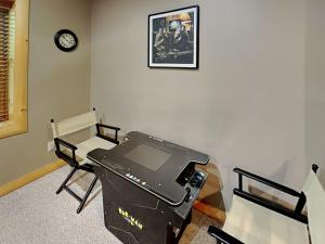 a room with a desk with a computer on it at Logged Out in Oakland