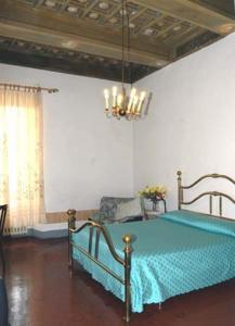 Giường trong phòng chung tại Albergo Anna