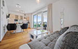 a living room with a couch and a table at Ferienwohnung Pörtschach in Pörtschach am Wörthersee