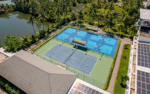 an overhead view of a tennis court with two courts at Cocoland River & Beach Resort in Quảng Ngãi +105 photos