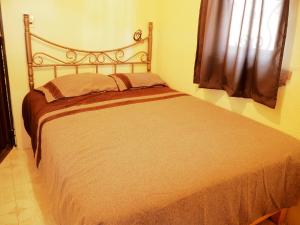 Ліжко або ліжка в номері Casa Rincon Colonial