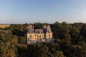 a large house in the middle of a forest at Château Stay – 1BR 4P with Pool & Park Access in Fajolles