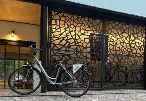 a bike parked in front of a building at Hotel Ladurner in Merano +69 photos