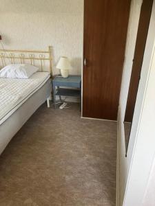 Postel nebo postele na pokoji v ubytování Trivsamt hus på Österlen i Ullstorp