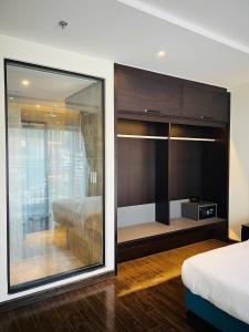 a bedroom with a large window and a bed at 16 Apartment - Studio Sapphire Halong in Ha Long