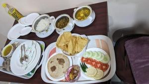 a tray of food with different types of food at Arara ibt homestay in Cherrapunji