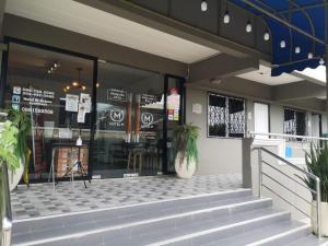 Fotografie z fotogalerie ubytování Capital O 75406 Hotel M Rojana v destinaci Ayutthaya