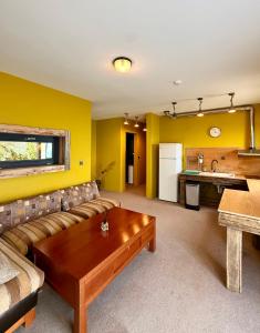a living room with a couch and a table at Hotel & Villas - TERIZIS Le Rocher in Bŭlgarevo