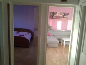 Łóżko lub łóżka w pokoju w obiekcie Apartment ML
