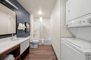 a white bathroom with a sink and a toilet at Everhome Suites Amarillo West - Medical Center by Choice Hotels in Amarillo +44 photos