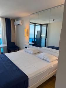 Ένα ή περισσότερα κρεβάτια σε δωμάτιο στο ORBI City ORIGINAL +60 φωτογραφίες