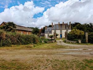 an old house in the middle of a field at Domaine de Launay blot in Baguer-Morvan