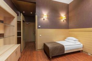 Vuode tai vuoteita majoituspaikassa Rixwell Elefant Hotel
