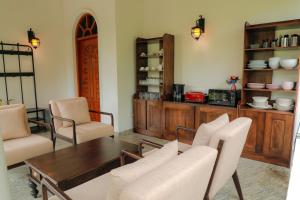 a dining room with a table and chairs at Liyara Villas in Gampola