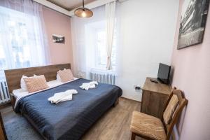 Posteľ alebo postele v izbe v ubytovaní Hotel Džbán