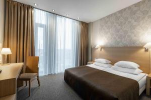 Vuode tai vuoteita majoituspaikassa Rixwell Elefant Hotel