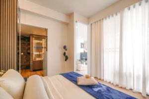 a bedroom with a white couch and a large window at Fin Villa Bang Saray in Bang Sare +142 photos