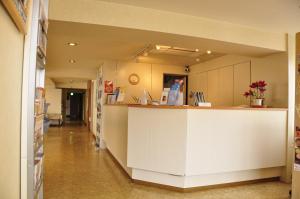 a hallway of a hospital with a reception counter at Hotel Kamoike Plaza in Kagoshima