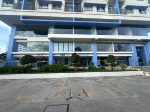 an empty parking lot in front of a building at Northwoods Place Condominium Unit1026 in Mandaue City +3 photos