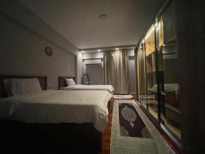 Postel nebo postele na pokoji v ubytování المهندسين شقه سوبر لوكس - محى الدين ابو العز