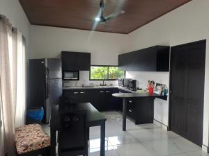 Photo de la galerie de l'établissement Cozy Apartment Rental, à Quepos