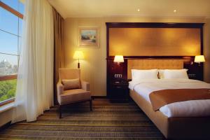 Ένα ή περισσότερα κρεβάτια σε δωμάτιο στο Shera Inn Hotel +30 φωτογραφίες