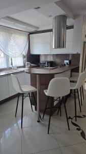 Kuchyň nebo kuchyňský kout v ubytování Perfect House + 4 fotografie