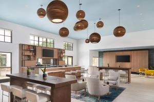 a dining room with a table and chairs at Element Lenox Berkshires in Lenox