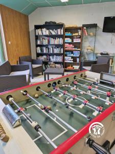 a room with a table with a pool table at Chalet la Brême in Villiers-Charlemagne +25 photos
